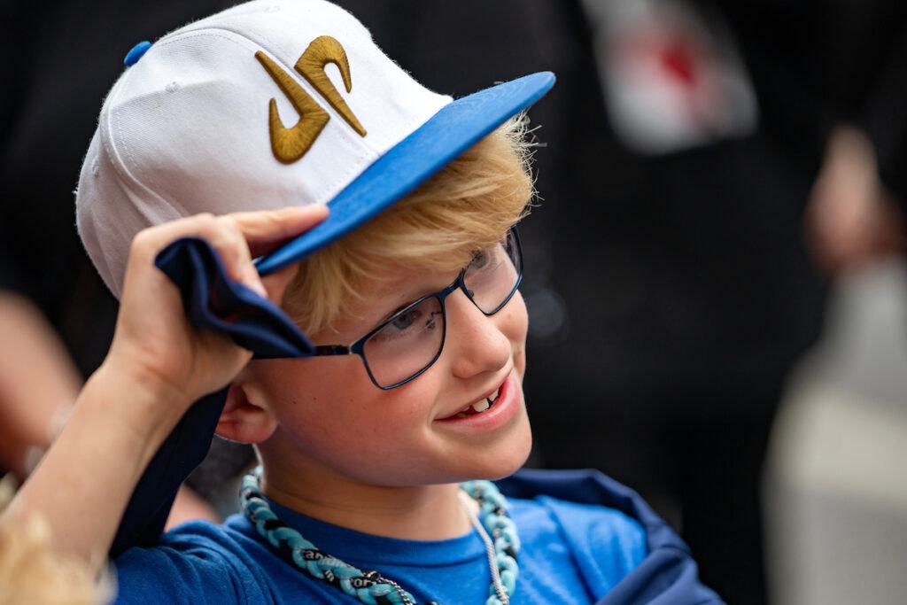 A young fan of Dude Perfect smiles outside the Majestic Theatre prior to the documentary screening.