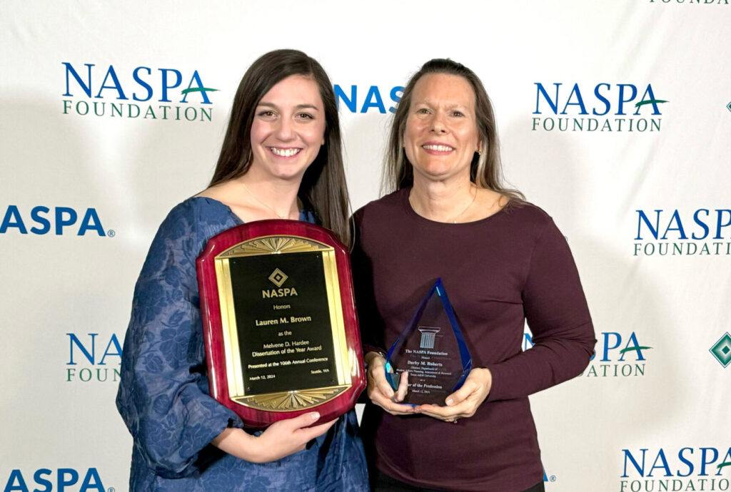 Dr. Darby Roberts and Dr. Lauren Brown posing with their NASPA awards
