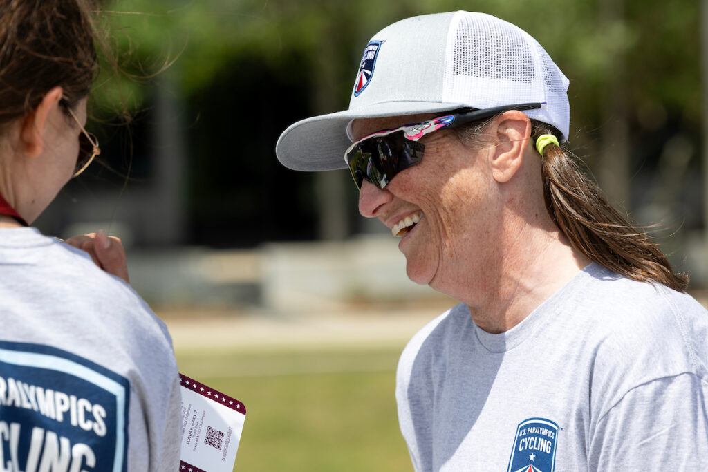 Dr. Lisa Colvin at the race speaking to a staffer