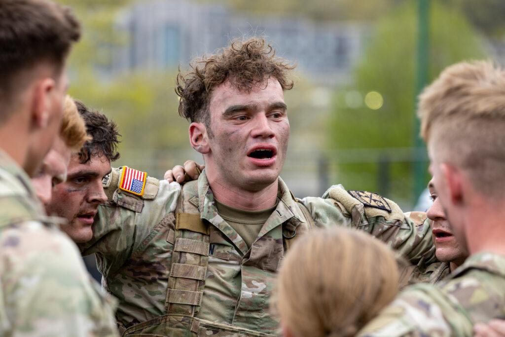 A Texas A&M University cadet speaks to other cadets after a military skills competition.