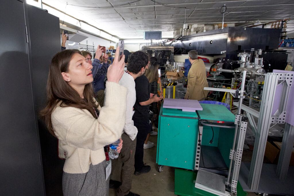 Hanna Dattilo takes a photo during a tour of the Cyclotron Institute on the Texas A&M University campus.