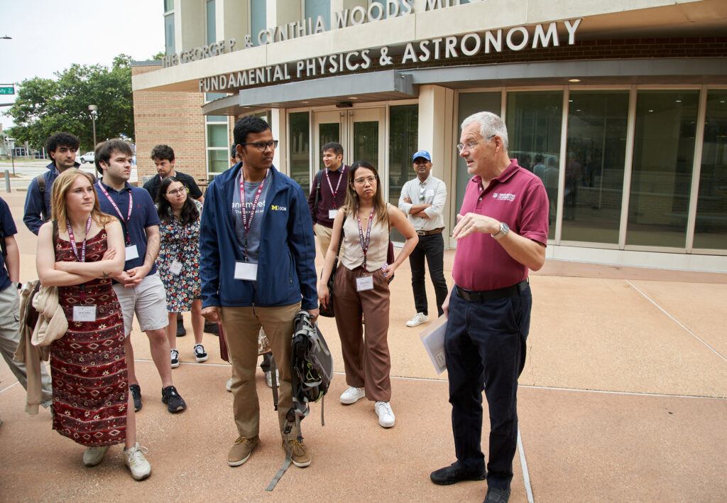 Dr. Joerg Steiner, university distinguished professor of veterinary medicine and faculty liaison for the Office of the Vice President for Research, chats with students participating in the Lindau Nobel Laureate Meetings during a tour of the Texas A&M University campus.