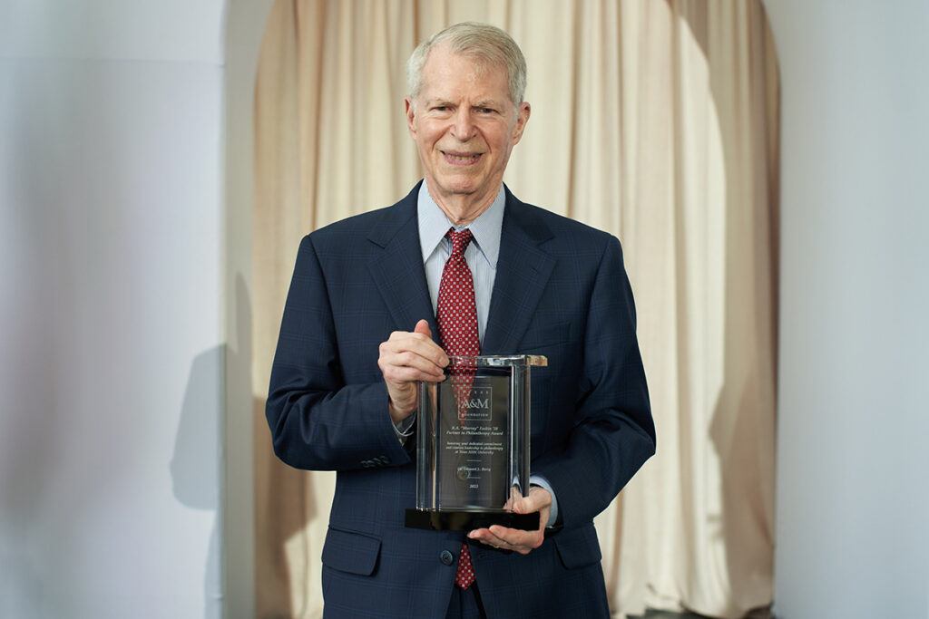 Dr. Leonard Berry holds the 2024 Texas A&M Foundation Partner In Philanthropy Award