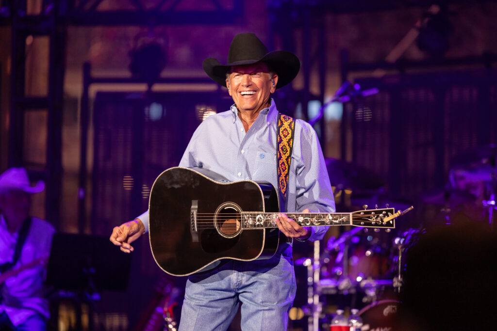 George Strait performs on stage at Kyle Field.