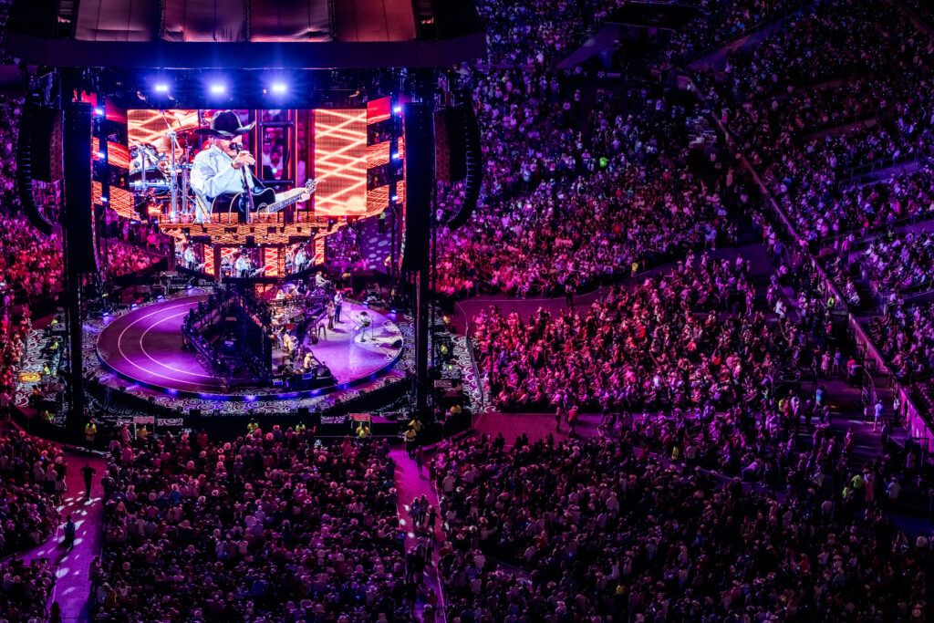 George Strait is seen on a video screen at a concert in Kyle Field.