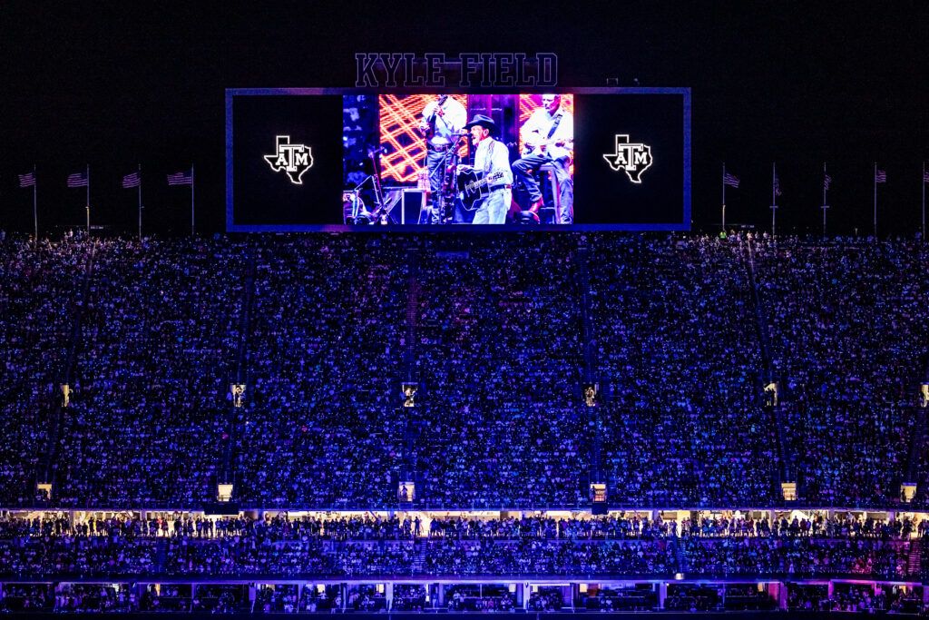 George Strait is seen on a video screen during a concert at Kyle Field.