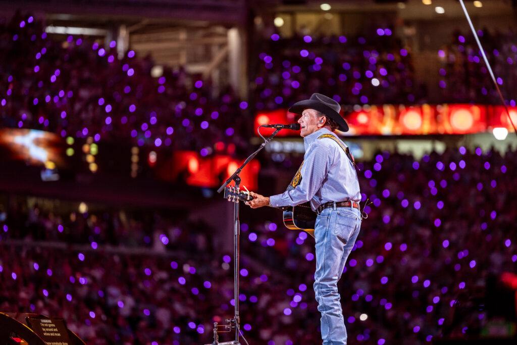 George Strait performs on stage at Kyle Field.