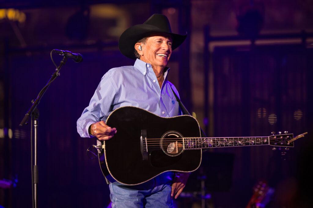 George Strait performs on stage at Kyle Field.