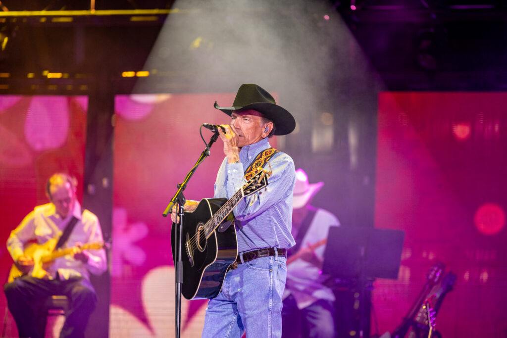 George Strait performs on stage at Kyle Field.