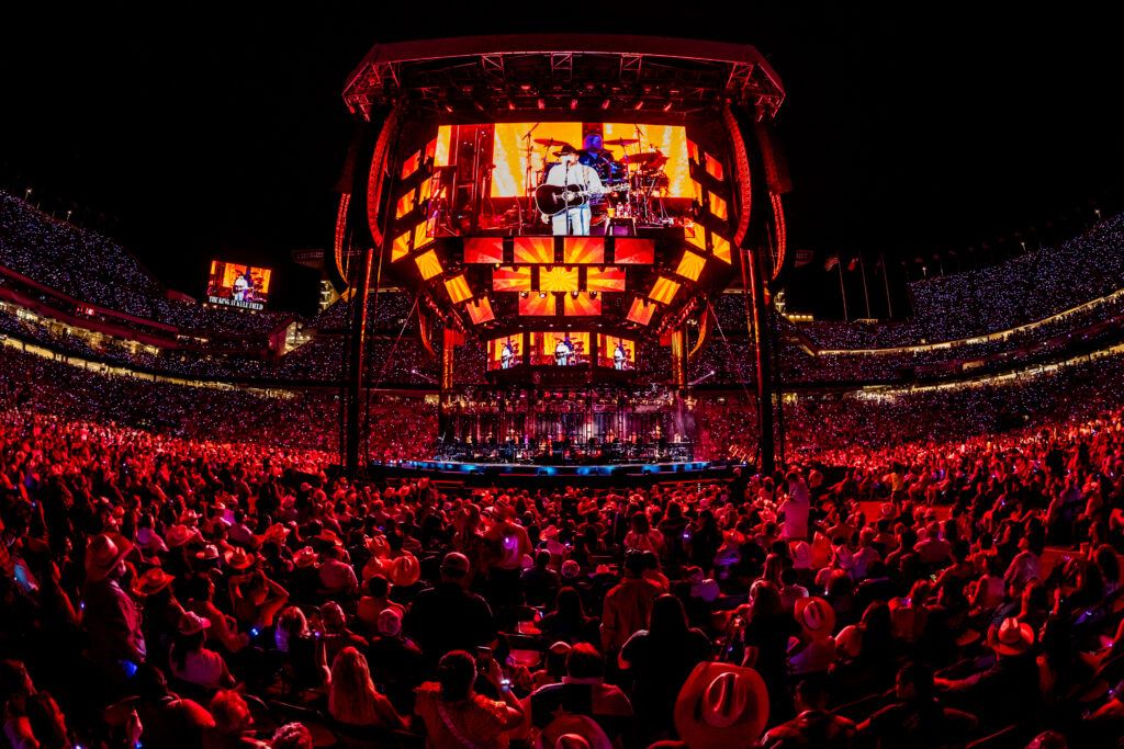 George Strait is seen on a video screen during a concert at Kyle Field.