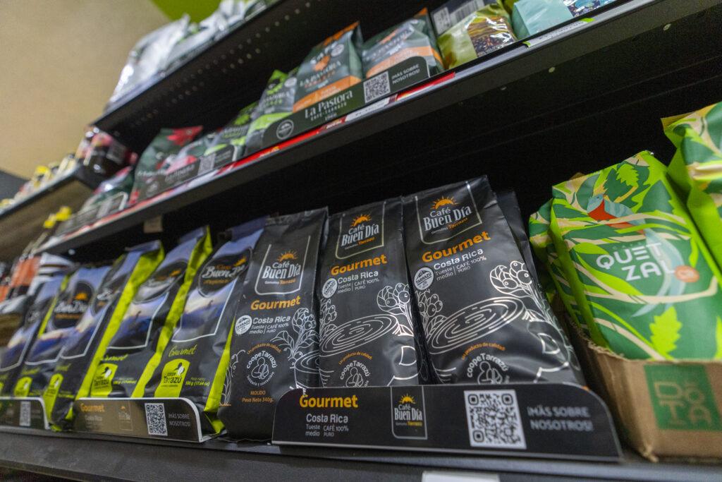 Bags of gourmet coffees displayed on a store shelf