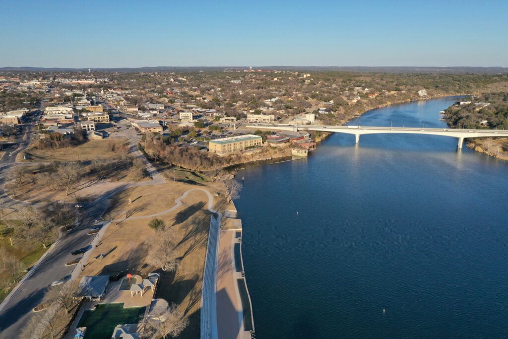 An aerial shot of the lake marble falls reservoir during the day in Texas