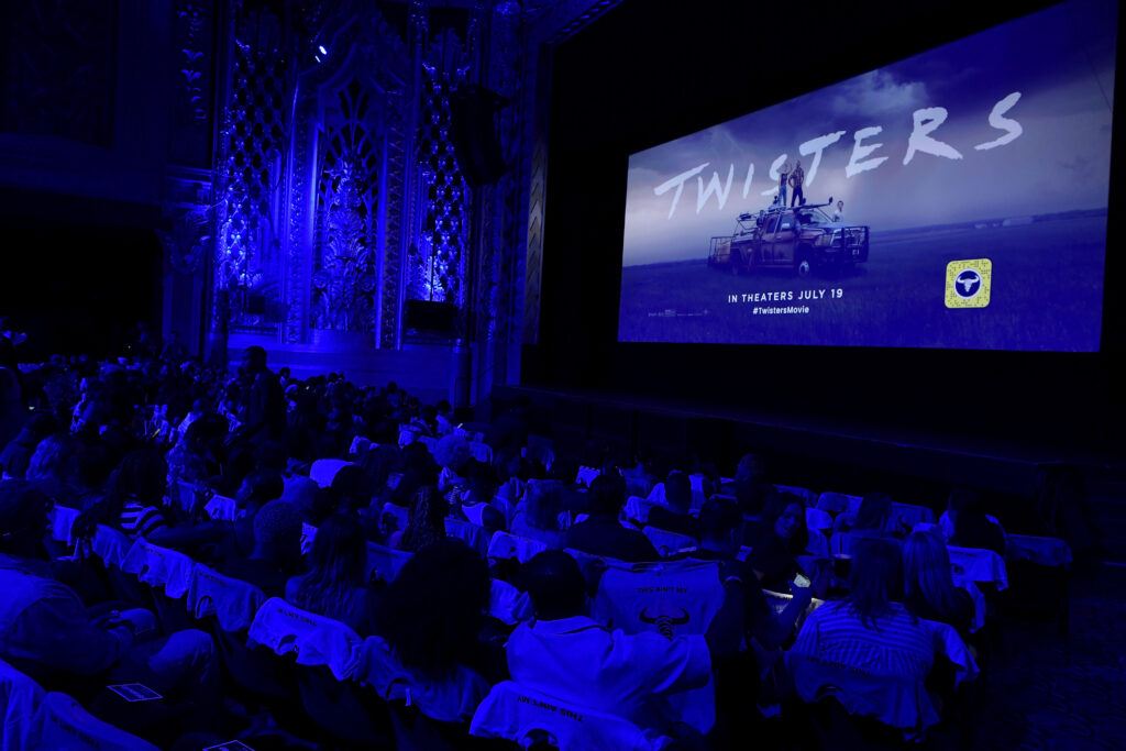 A photo of a movie theater screening of the movie Twisters.