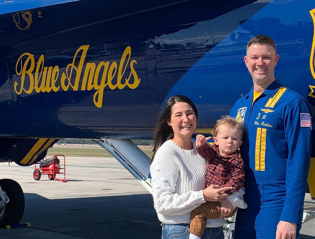 James Perkins with his family in front of his Blue Angels plane