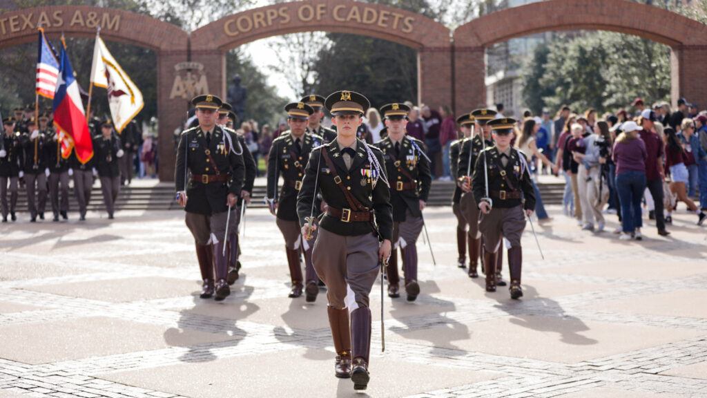 Cadets from Texas A&M University step off from The Quad during a fall march-in prior to a home football game.