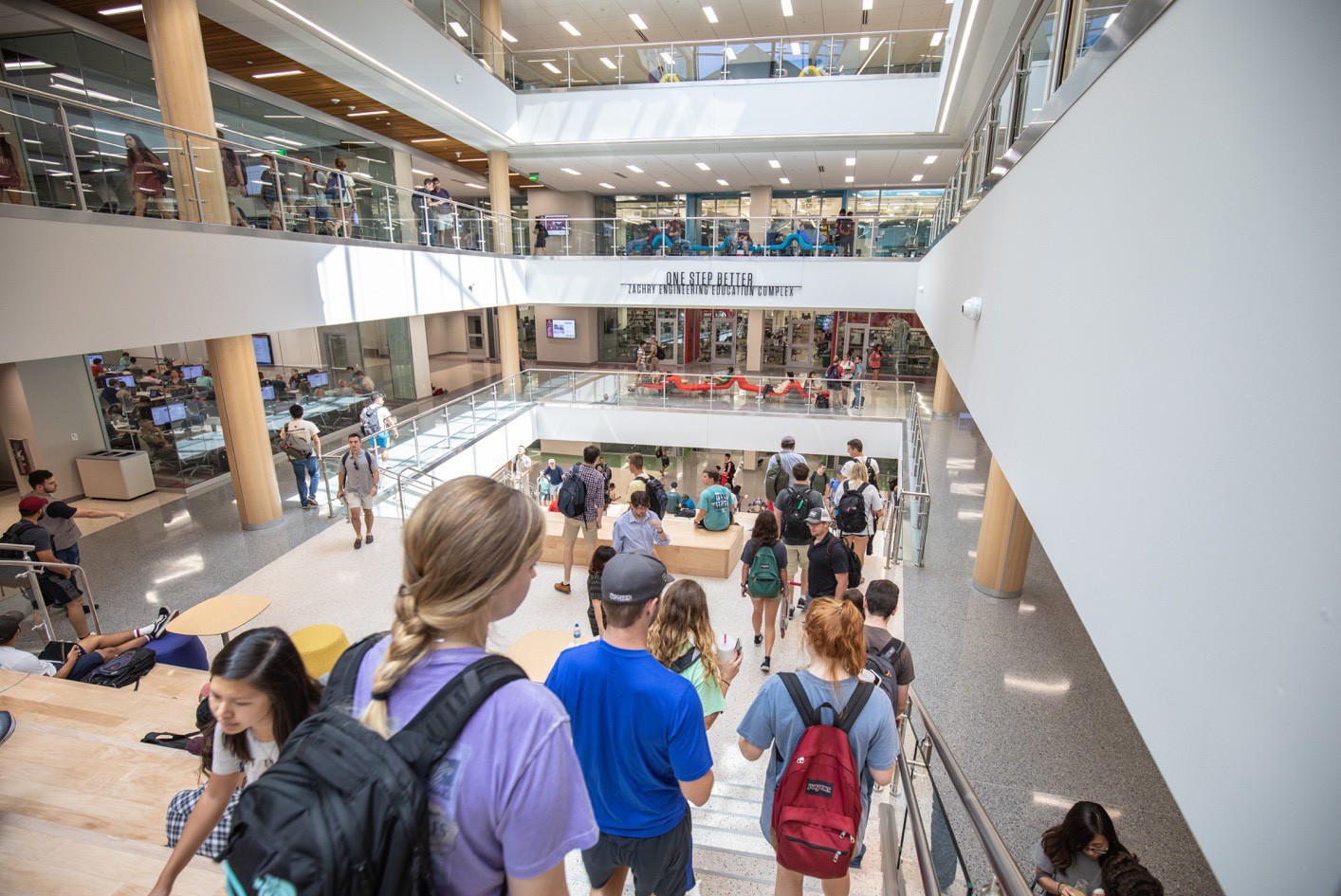 People walking in a crowded staircase