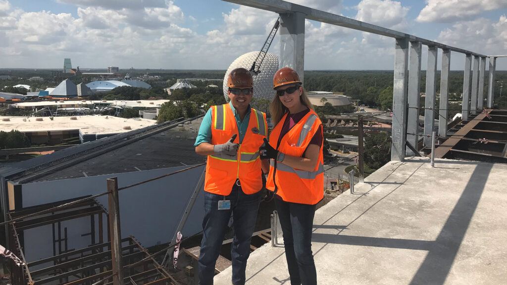 (l-r) Andres Ovalles '08 and Emily Richardson '01 on top of Guardian’s of the Galaxy Cosmic Rewind.