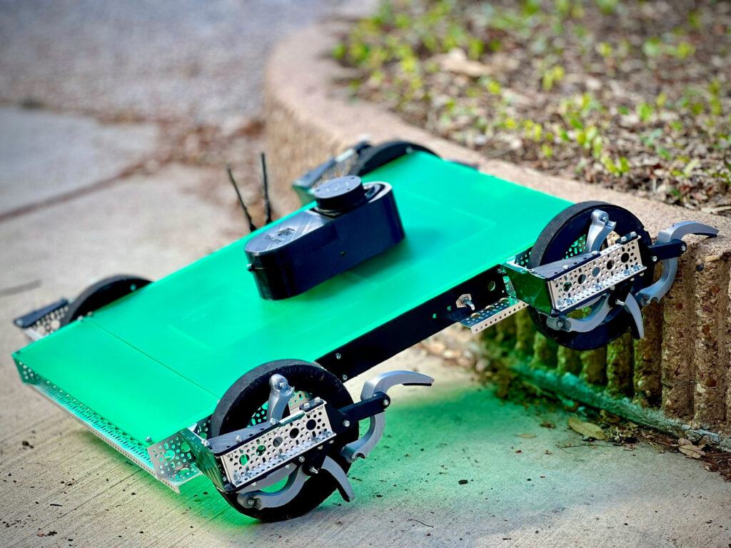 CLAWbot easily tackles a barrier in its path.