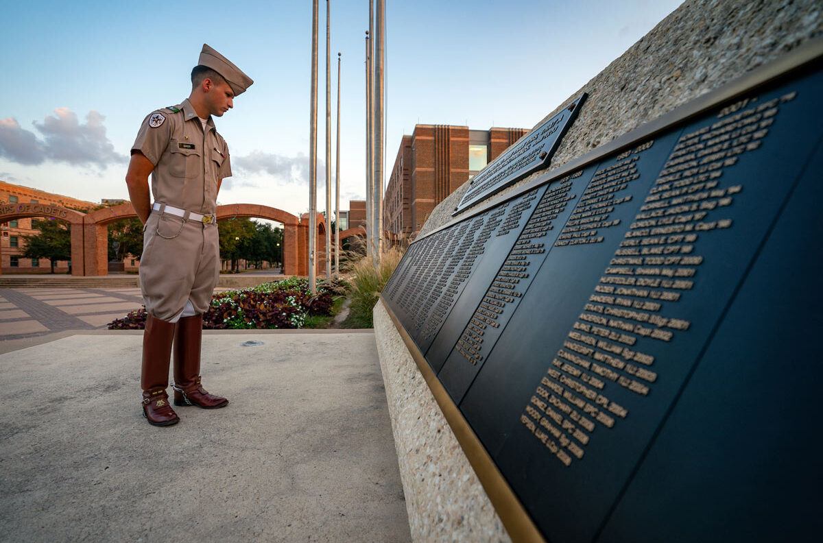 Cadet Jackson Baker looks at the names on the John 15:13 memorial in Corps Plaza