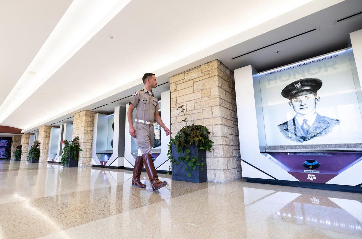 Jackson Baker walks the Hall of Honor in the Memorial Student Center