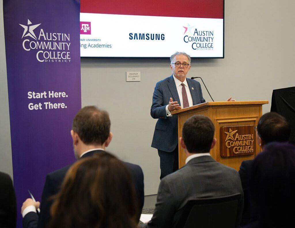 Dr. Robert H. Bishop addresses attendees at the event celebrating Samsung Austin Semiconductor's support of the Texas A&M Engineering Academy at Austin Community College.