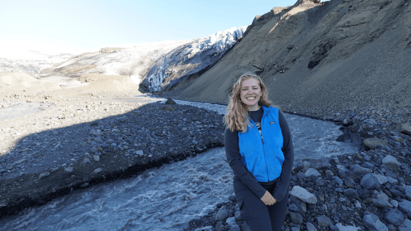 Lauren Berger poses in front of an Iceland glacier