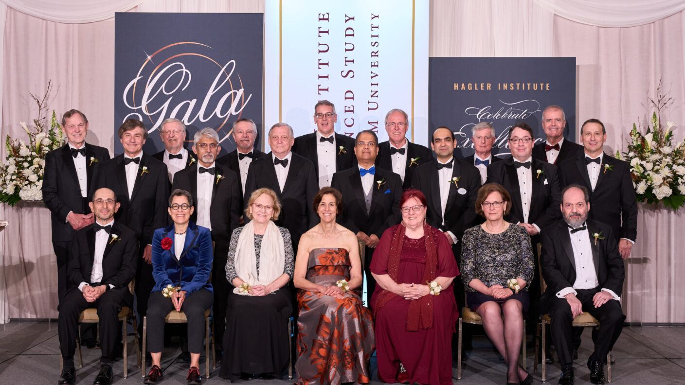 A group photo of the 2024-2025 class of Hagler Fellows at a formal gala event.