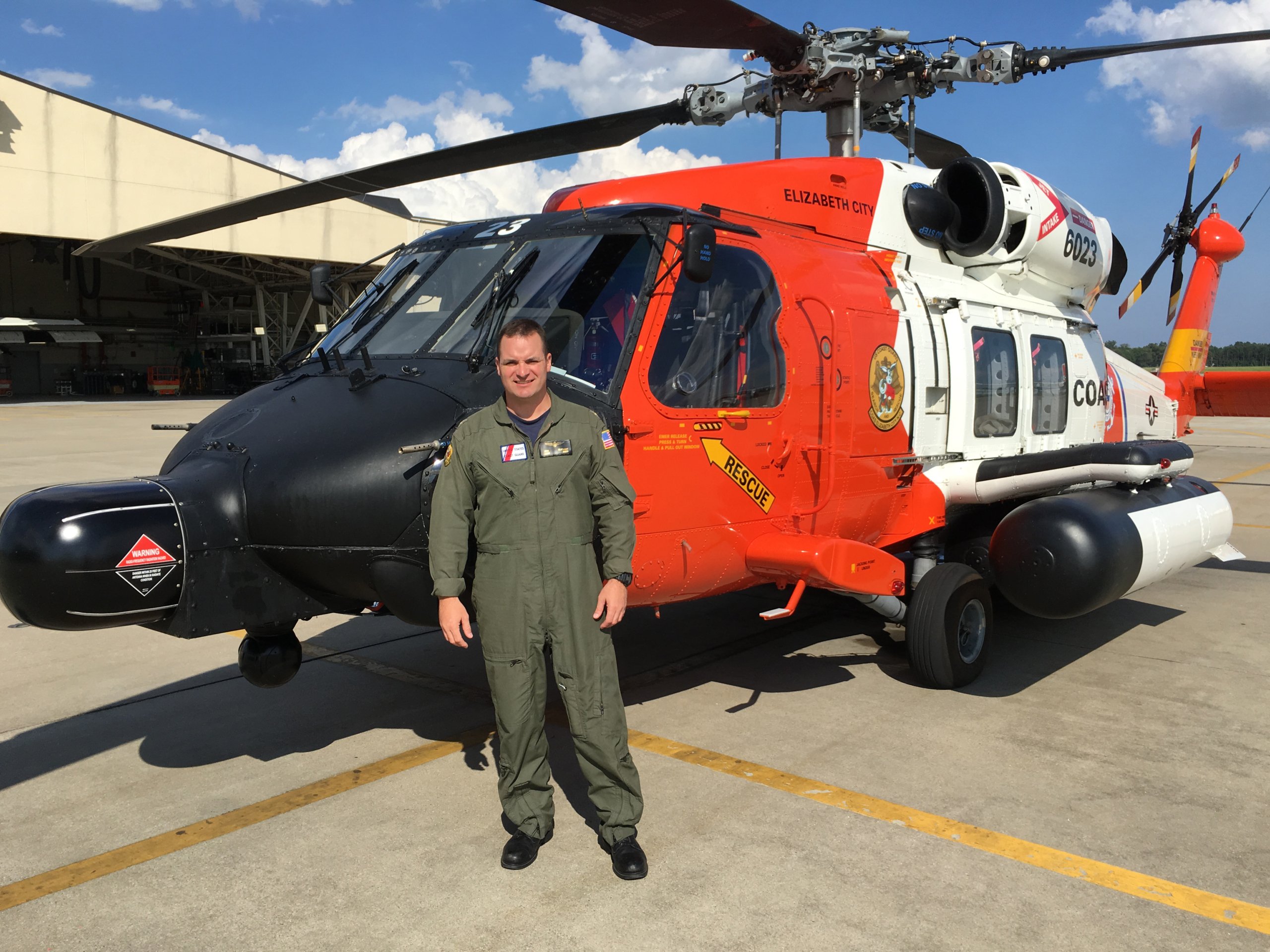 Eric Oliphant in front of his coast guard helicopter