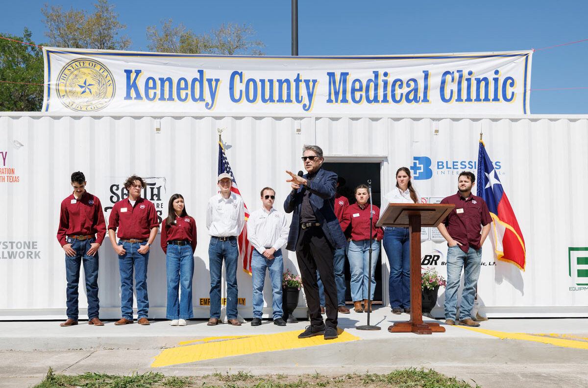 A speaker addresses the crowd at the Kenedy County Medical Clinic ribbon cutting ceremony