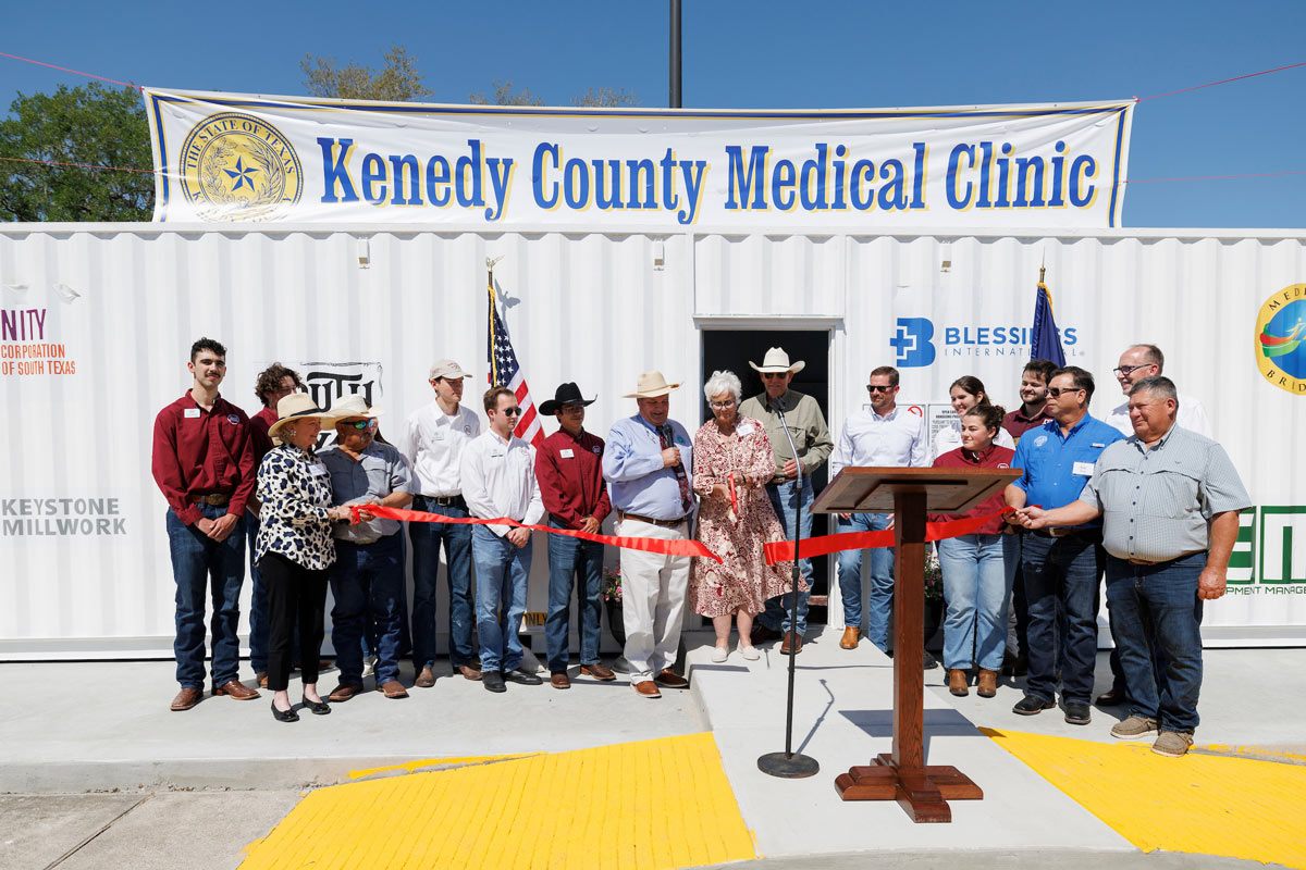 Official moment the red ribbon is cut to ceremonially open the Kenedy County Medical Clinic
