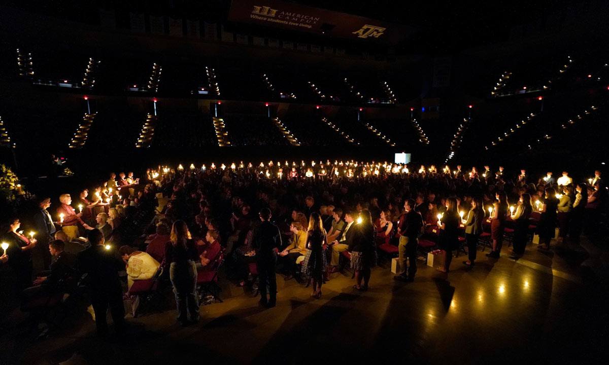 View of Reed Arena in candlelight during the 2022 Muster ceremony.