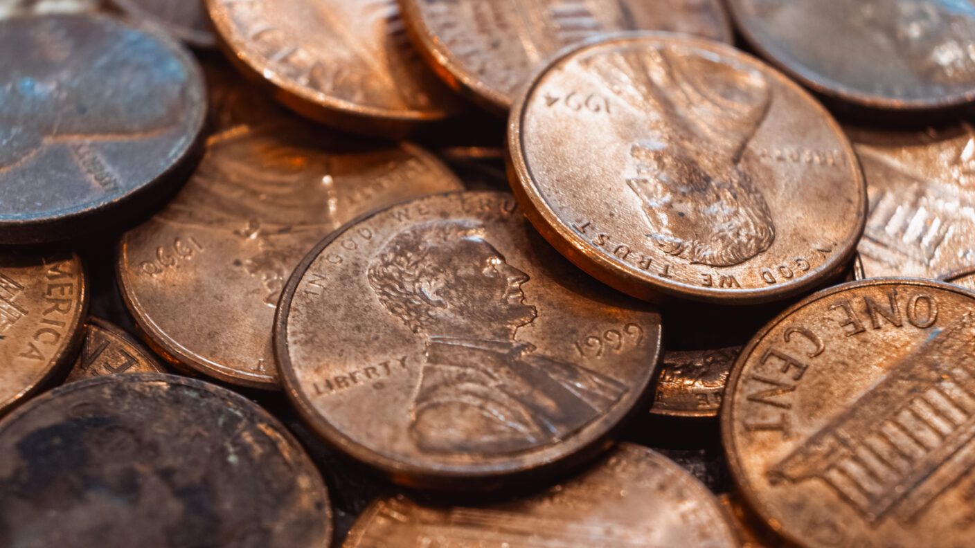 A close-up shot of a pile of U.S. pennies.