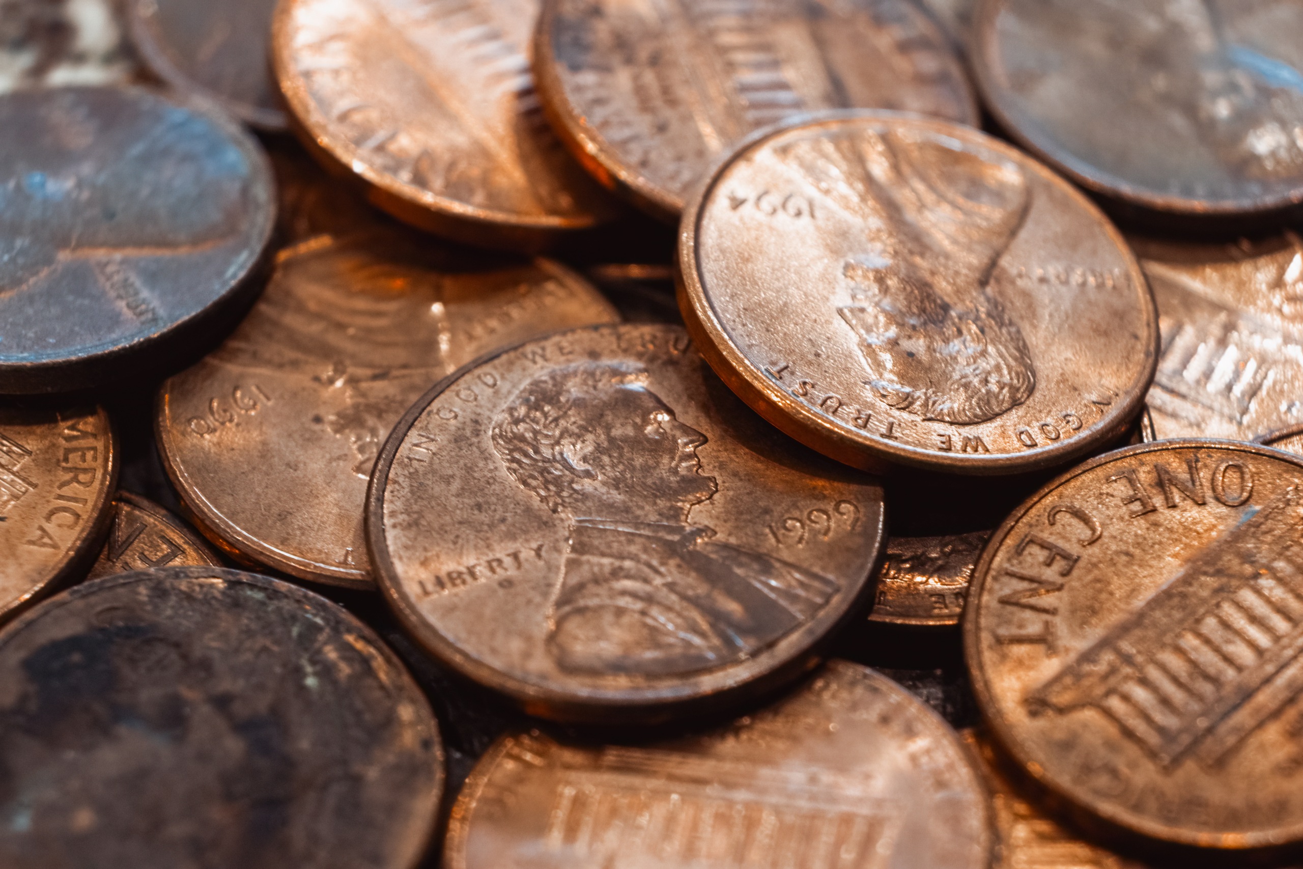 A close-up shot of a pile of U.S. pennies.