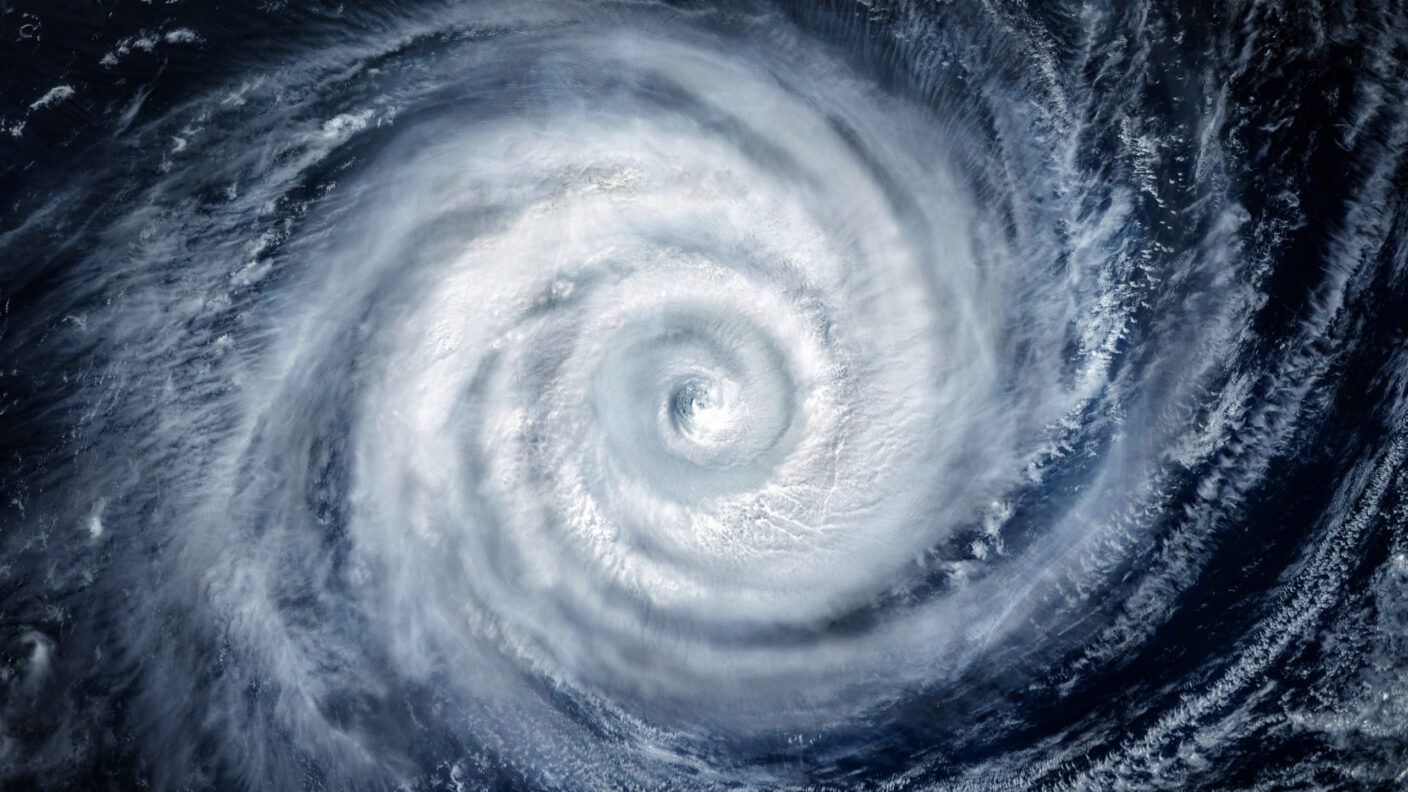 A photo of a hurricane over the ocean taken from a satellite image.