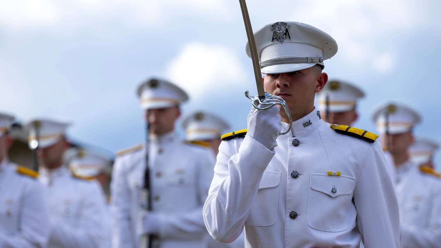 Corps of Cadets Ross Volunteer Company give a military salute
