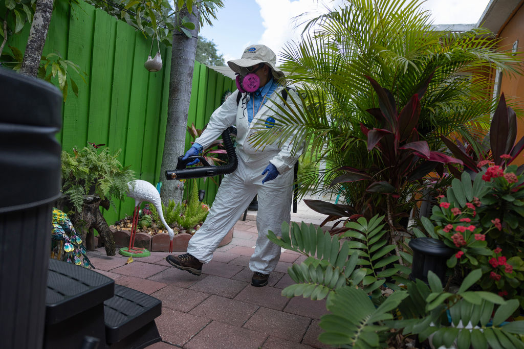 MIAMI, FLORIDA - JUNE 29: Margine Rodriguez, a Miami-Dade Mosquito Control Inspector, sprays a pesticide to kill adult mosquitos on June 29, 2023 in Miami, Florida. The Miami-Dade mosquito control department continues its regular spraying and inspection of neighborhoods and is ready to react if malaria-carrying mosquitos are found. Four people in Sarasota County, Florida, and one in Cameron County, Texas, reported cases of the mosquito-borne illness.