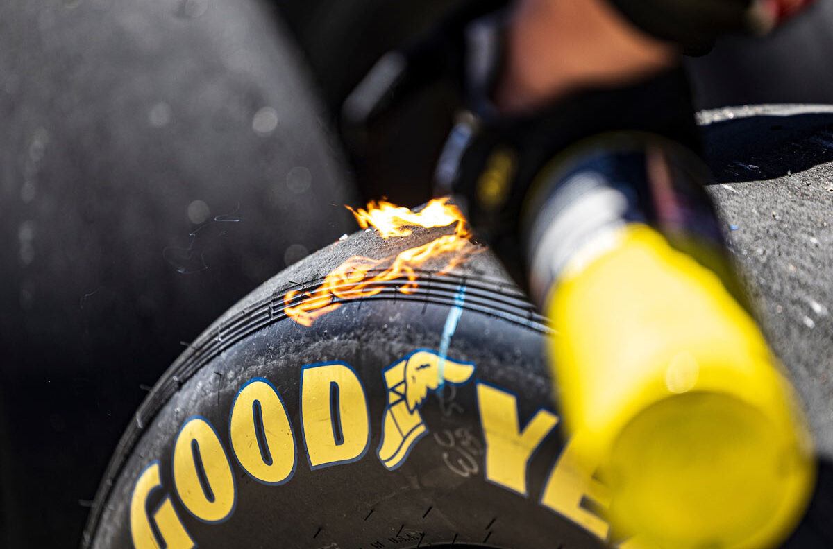 A flame on a tire being extinguished