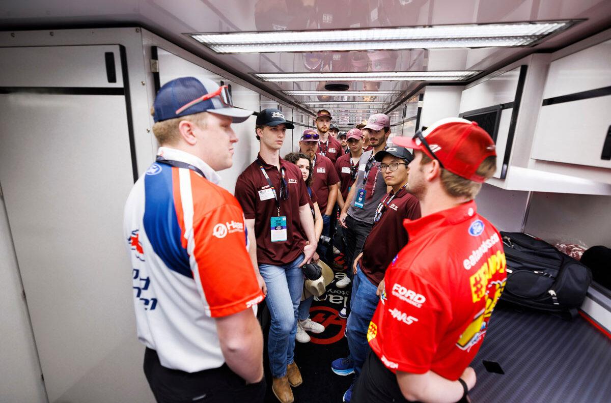 Aggie students meet with NASCAR drivers and pit crew before a race