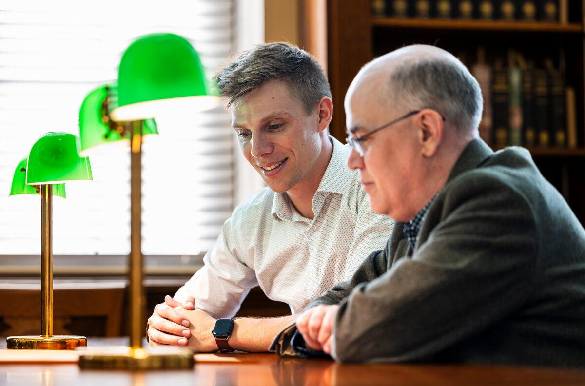 Tristan Krause working with a Texas A&M professor