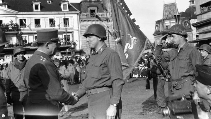 Historic photo of Lieutenant Colonel James Earl Rudder shaking hands with the Commander in Chief of the French Armies during World War II