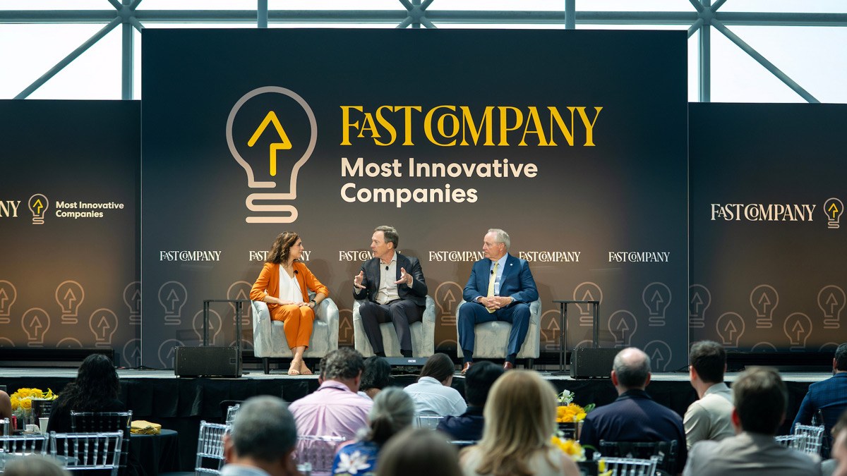 President Welsh and Dean McLaughlin sit and speak on stage at the Fast Company Most Innovative Companies Gala