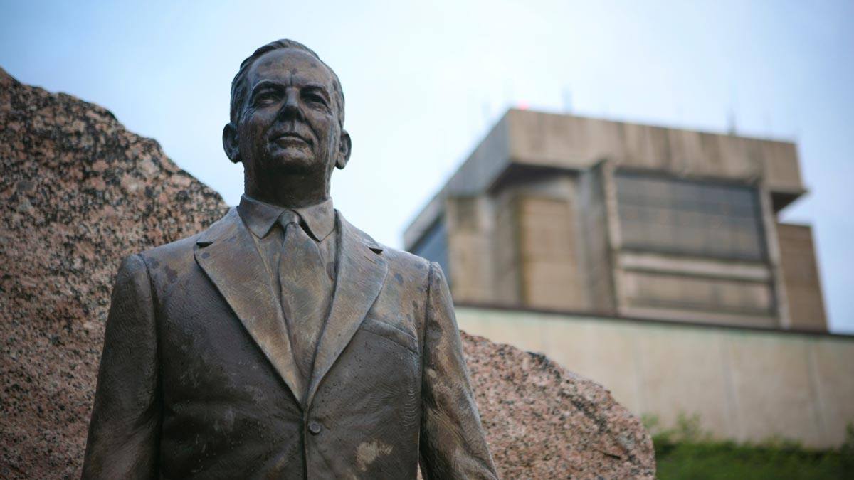 Gen. James Earl Rudder statue with Rudder Tower in the background