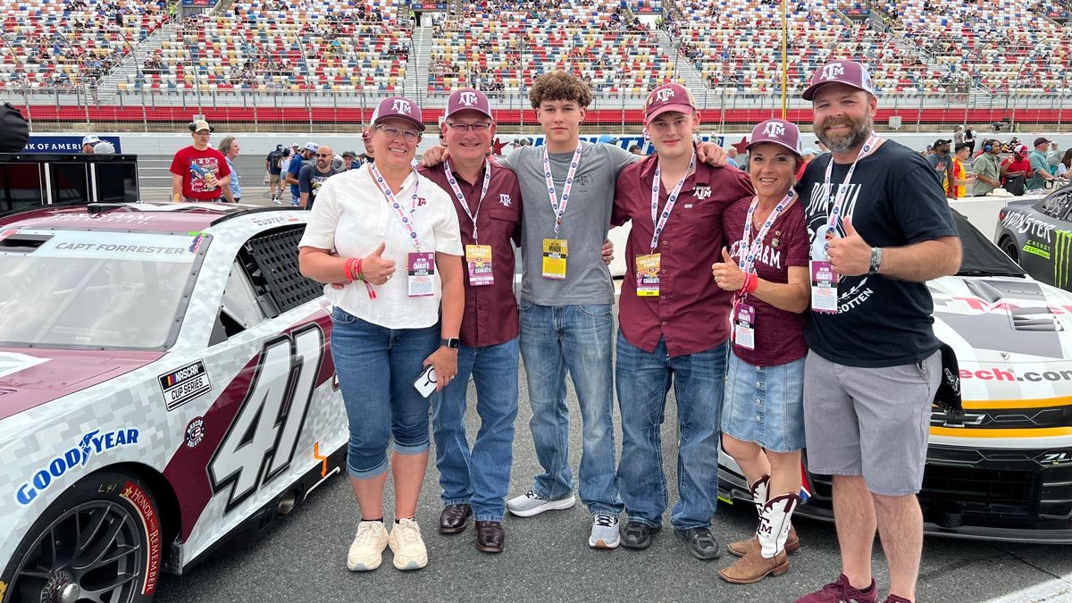 Forrester family in front of the Capt. Forrester memorial car