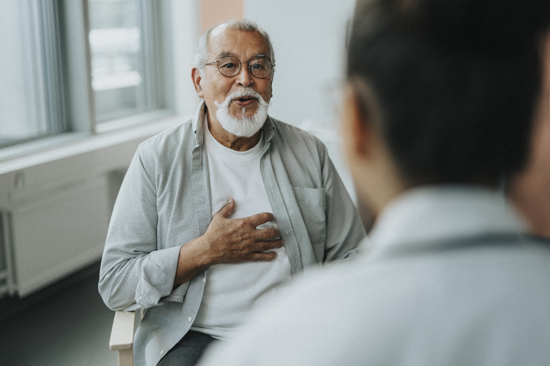 a male patient talking to his doctor