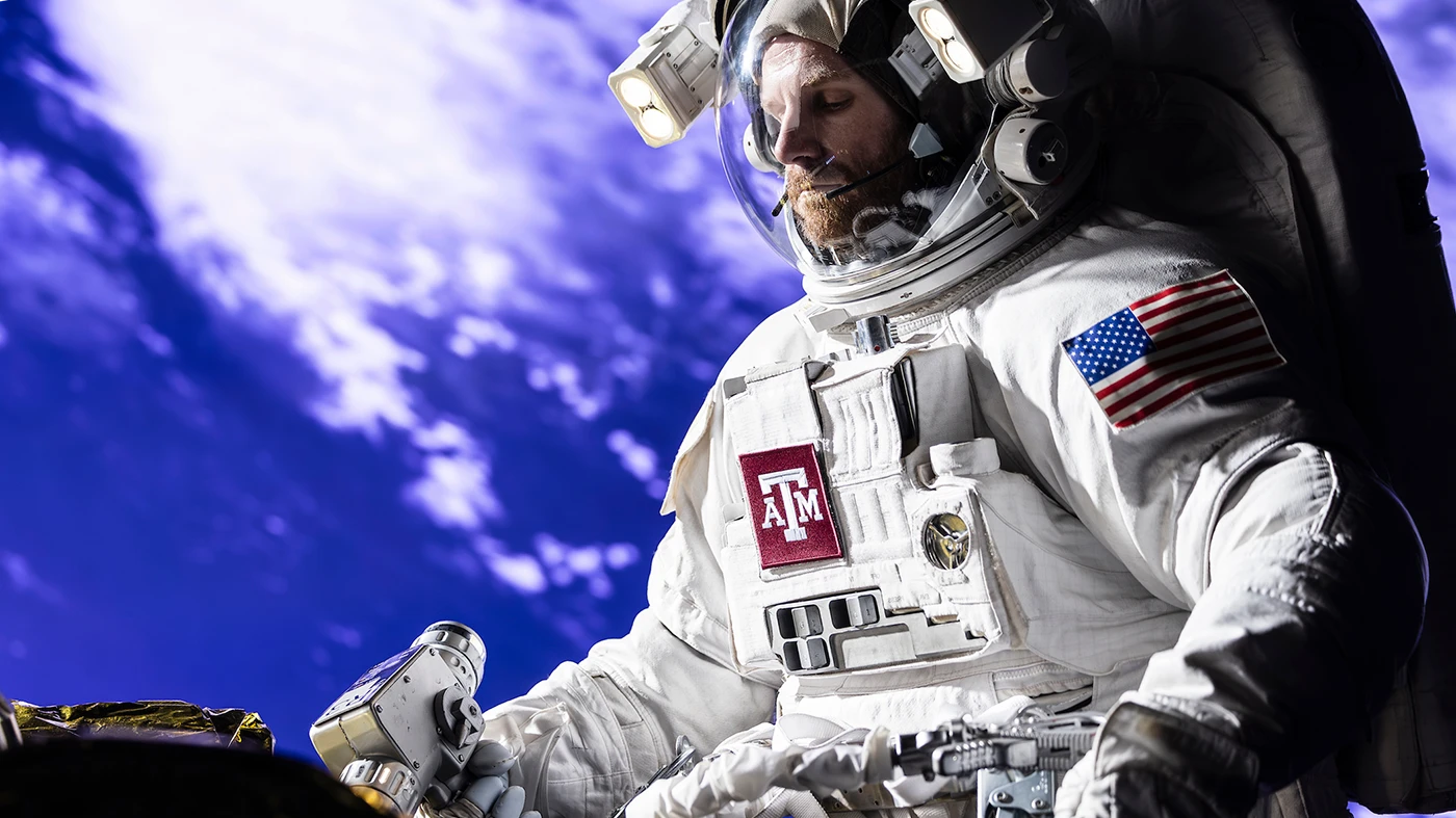 Astronaut on a space walk welding on a satellite