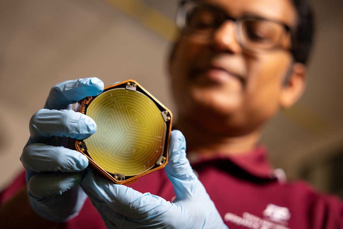 Dr. Rupak Mahapatra holds a TESSERACT detector