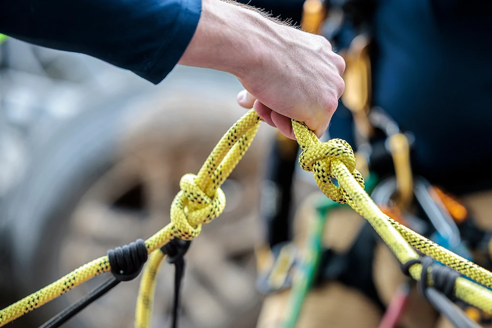 Task Force 1 member holding safety ropes taut