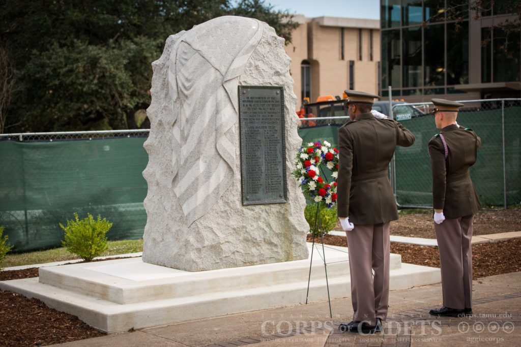 Two cadets salute WWI memorial