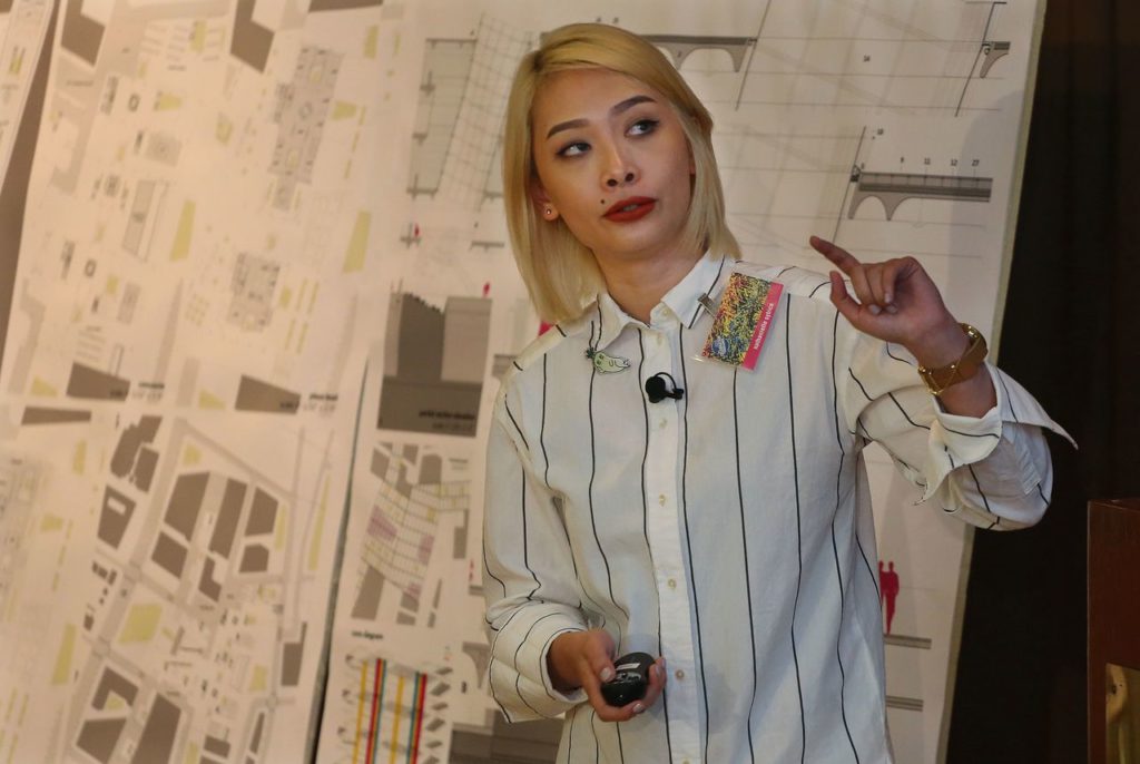 Woman presenting an architectural project