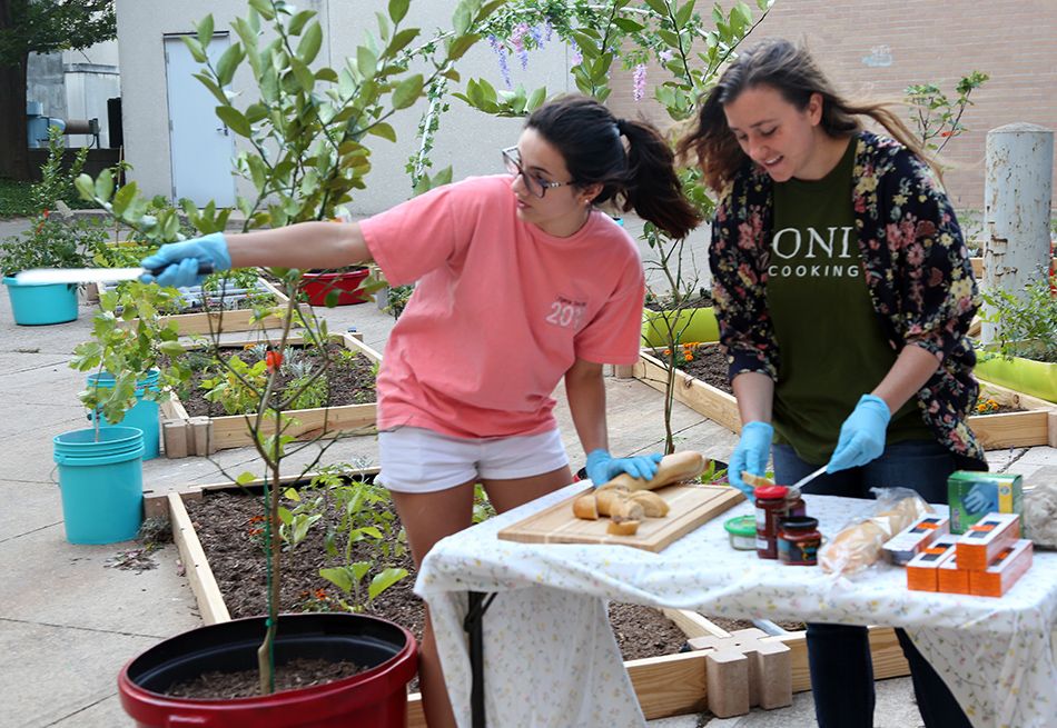 Environmental design student Mackenzie Anderson sets up food.